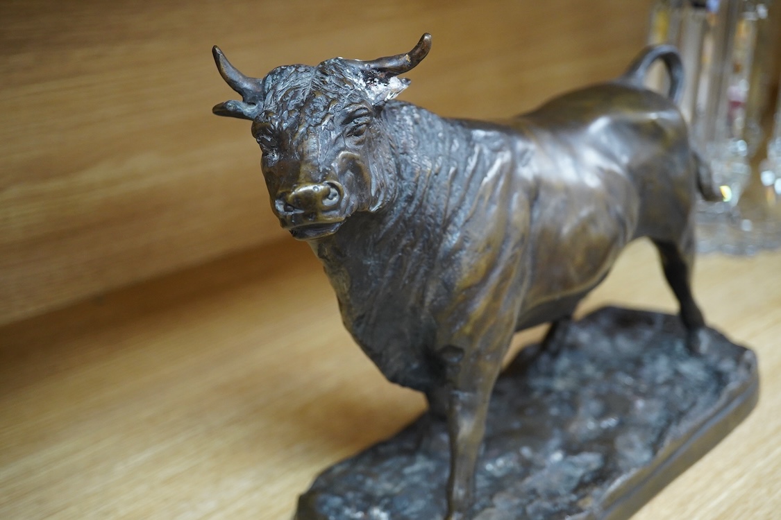 An Animalier style bronze model of a bull, unsigned, 33cm wide
